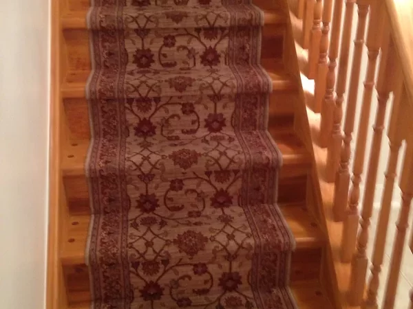 Carpeted wooden stairs renovated by David's Quality Renovations